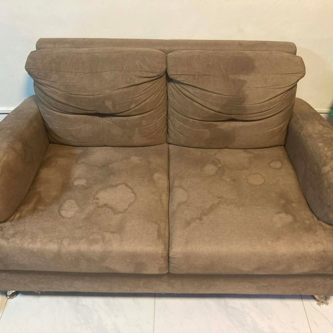 Brown loveseat before deep clean